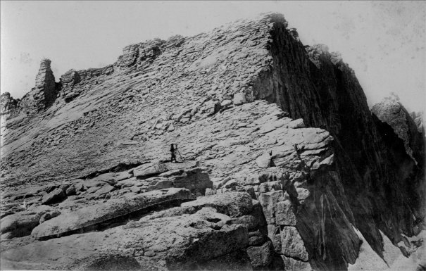 SUMMIT OF MOUNT HOFFMANN. Charles F. Hoffmann, cartographer with the Geological Survey of California, at the transit. Photograph by W. Harris, 1867, first published in J. D. Whitney's 'The Yosemite Book' in 1868. (Fig. 3)